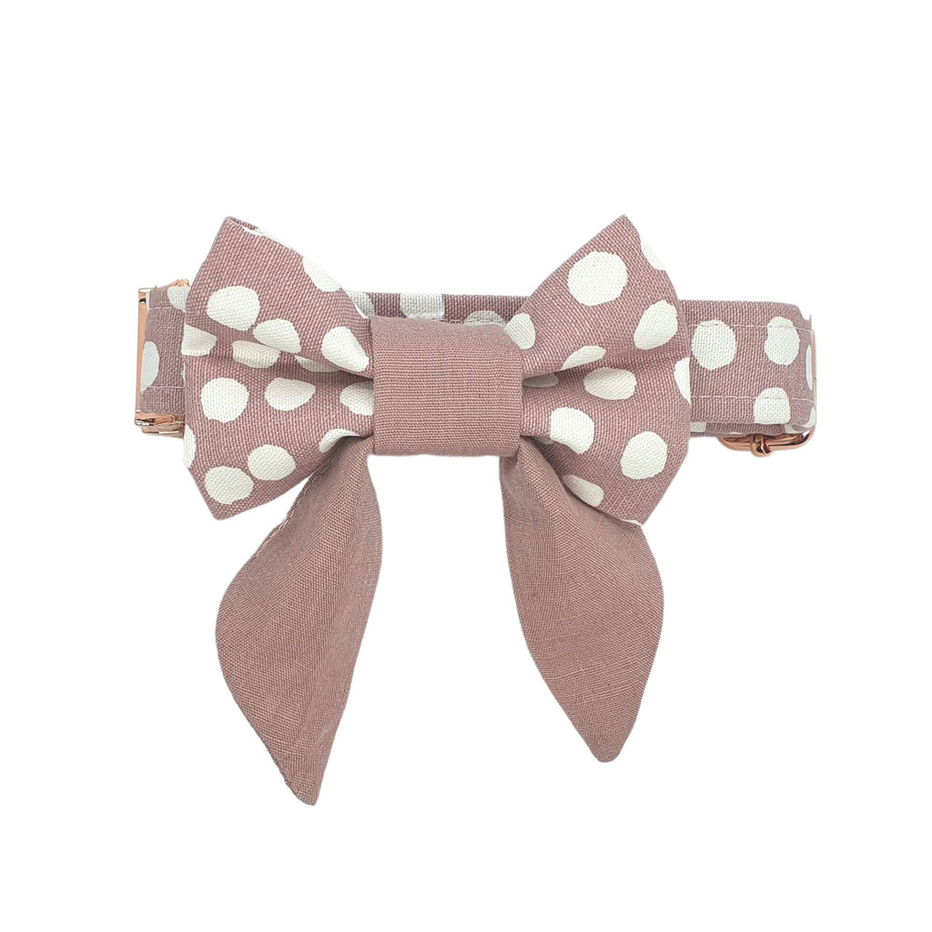 Pink polka dot pet sailor bow attached to matching collar