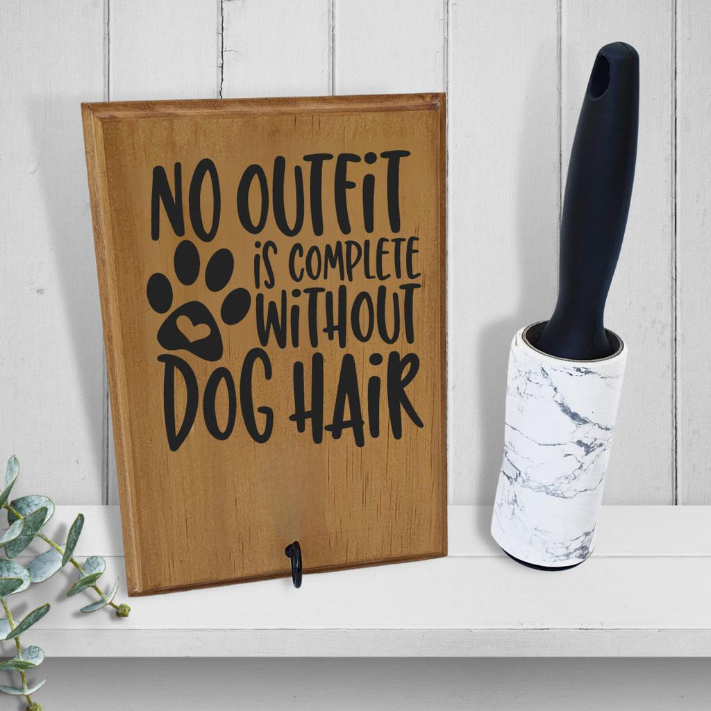 'No outfit is complete without dog hair' lint roller holder with lint roller