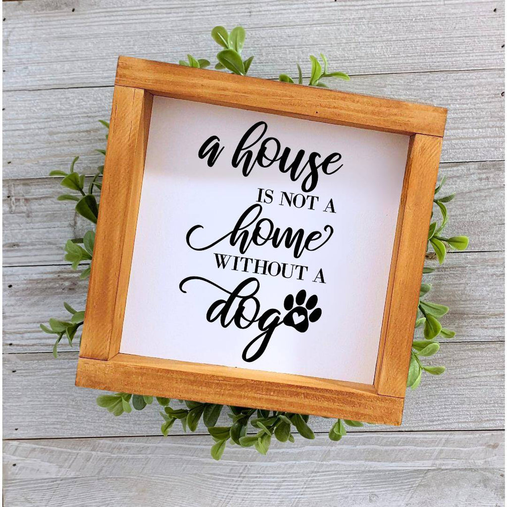 Farmhouse style wooden sign with 'A house is not a home without a dog' design