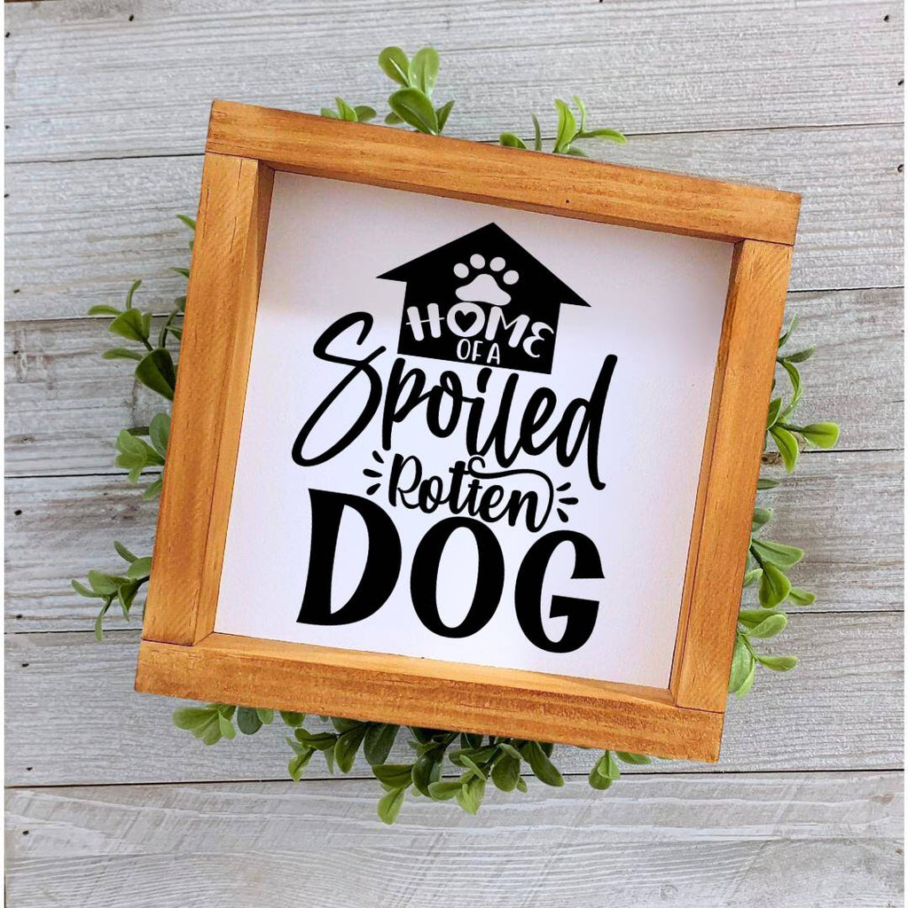 Farmhouse style wooden sign with 'Home of a spoiled rotten dog' design