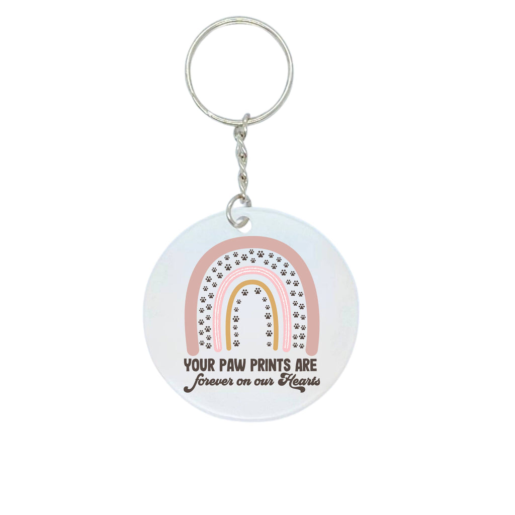 Pet memorial keyring with rainbow and 'your paw prints are forever on our hearts' design on white background