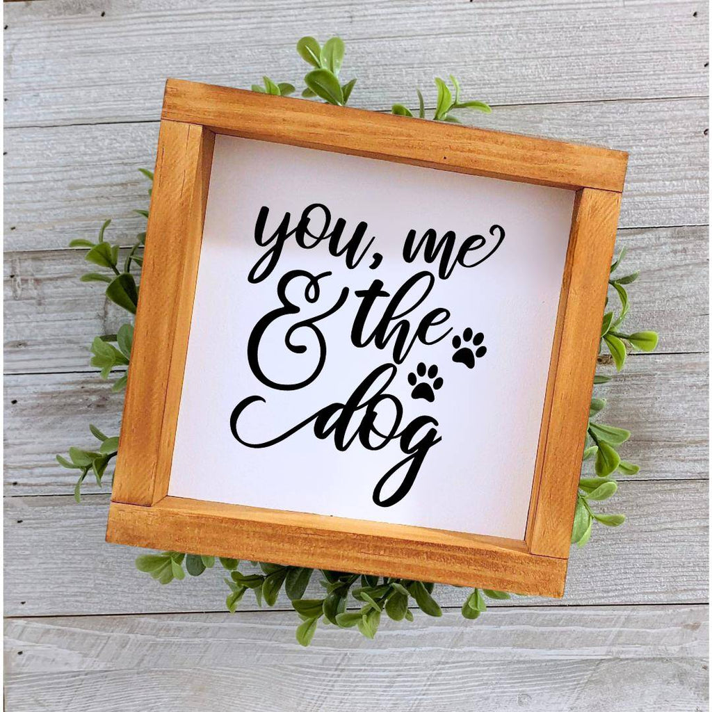 Farmhouse style wooden sign with 'You, me and the dog' design