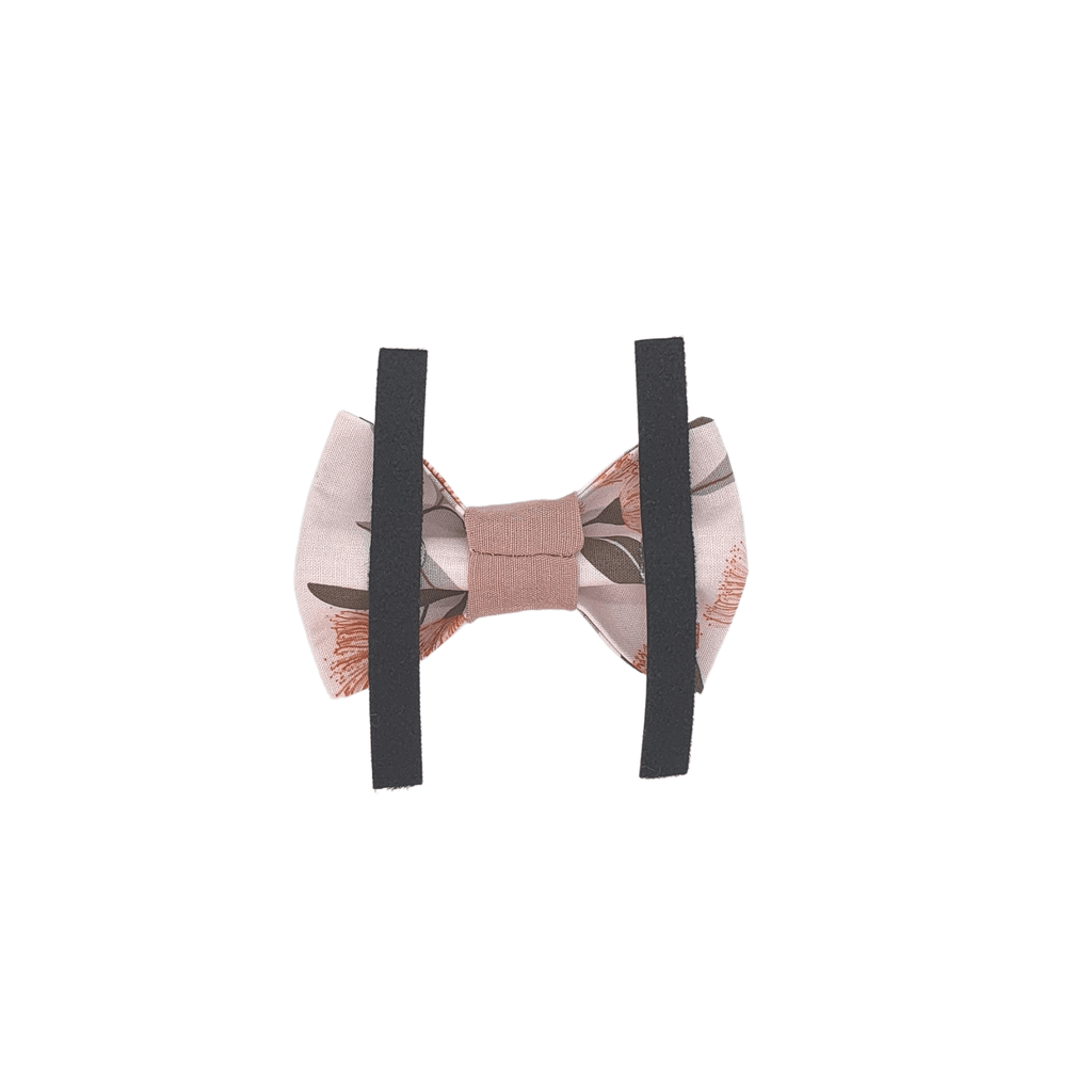 pink dog bow tie with velcro straps for attaching to collar