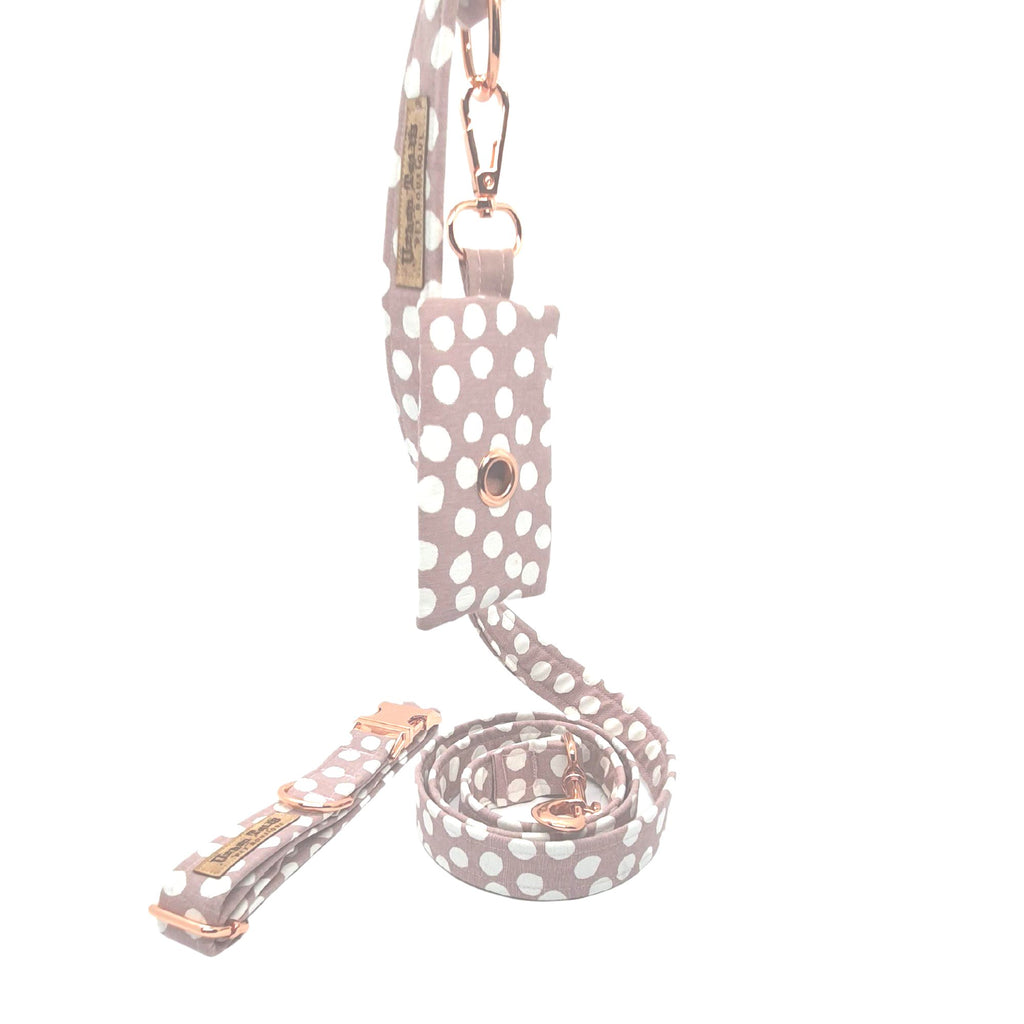 polka dot dog waste bag dispenser attached to matching leash and collar
